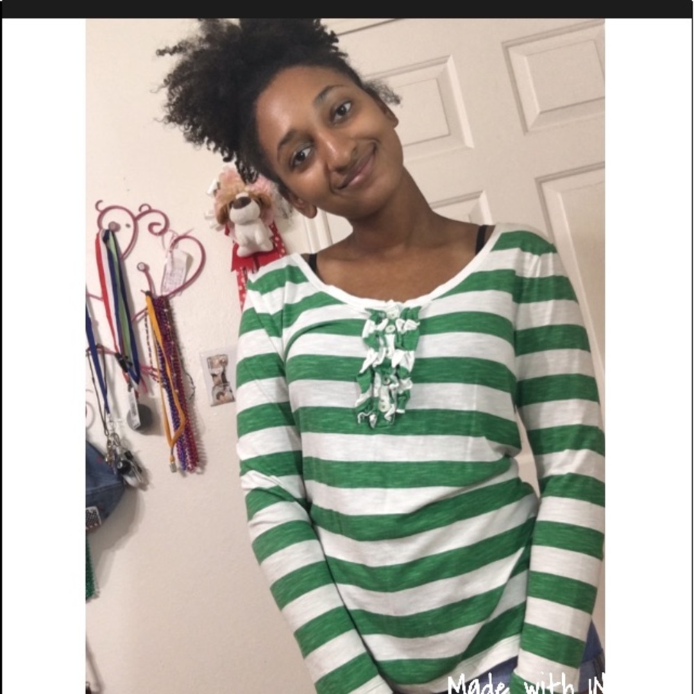 Long sleeve green and white striped top.